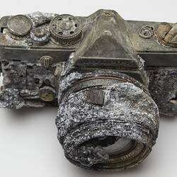 Fire afffected melted metal and plastic camera.