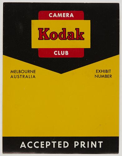 Rectangular yellow and black label with red, white and black printed text.