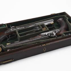 Pair of duelling pistols in wooden case.