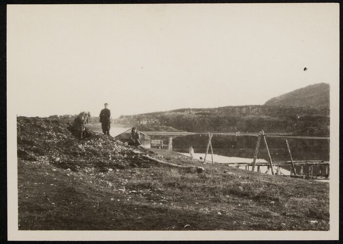 An-ma-tsing-this [George], his wife Shu-maui-naua-laka-kipa and Jean Hamilton, excavating a kitchen midden on Navarino Island. May-June 1929