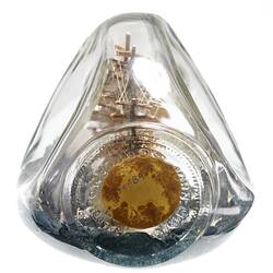 Model sailing ship in glass bottle. Cork end view.