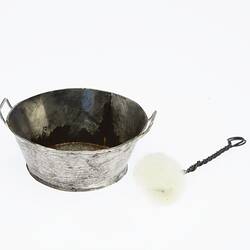 Miniature silver cleaning pan and brush. Brush has twisted wire handle and white scourer at end.