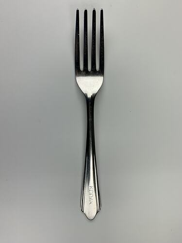 Metal fork with Kodak on handle.
