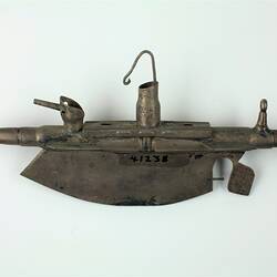 Trench art submarine, side view.