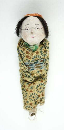 Small Japanese doll in kimono, front side.