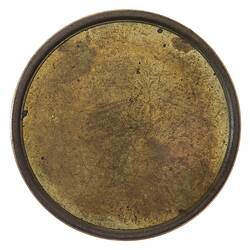 Round bronze coloured coin. Plain.