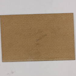 Retangular brown card.