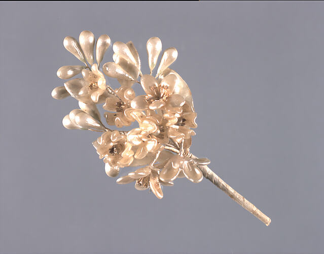 Pearly spray of artificial flowers.
