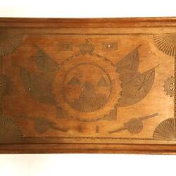 Wooden tray carved with sphinx, pyramids, flags and cannon. Handles each side.