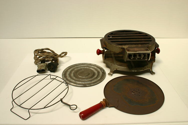 Griller with parts around.