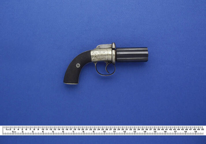 Small six barrelled revolver.