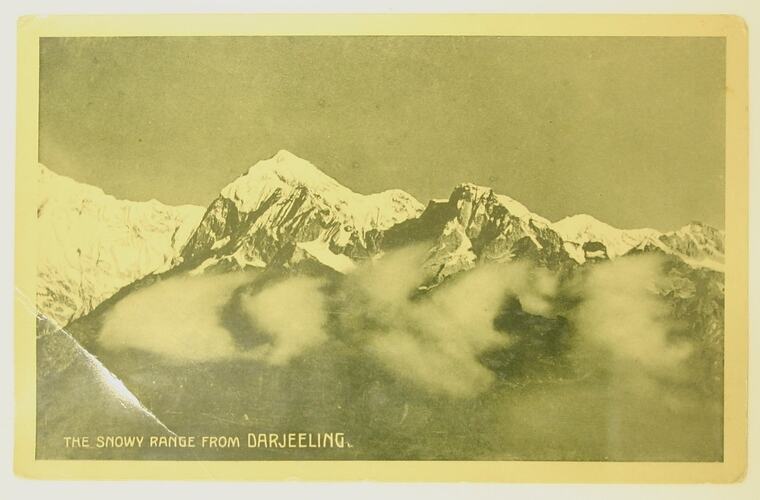 Postcard depicting mountain range.