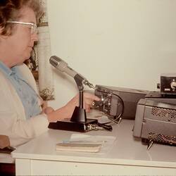 Digital Photograph - Woman using Kenwood Shortwave Radio in Home, Brighton Beach, 1980