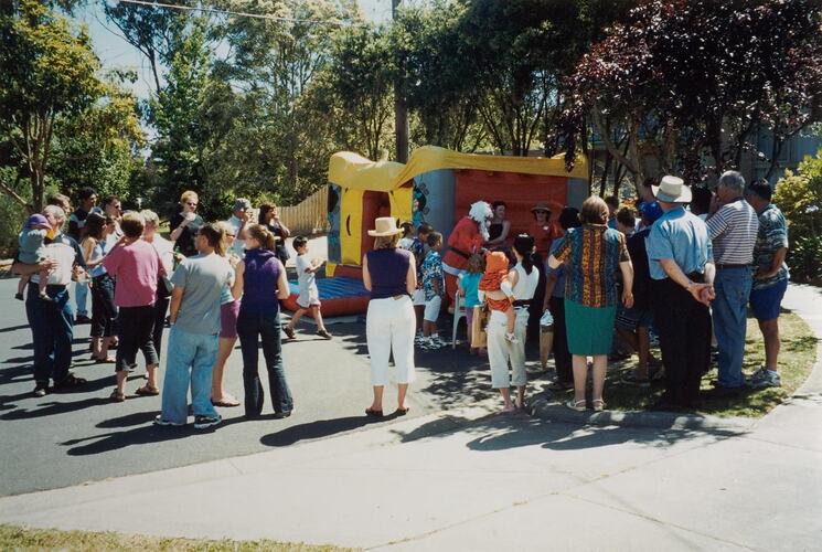 Digital Photograph - Crowd of Bystanders Watching 'Bouncy Castle', Christmas Street Party, Vermont, 2000