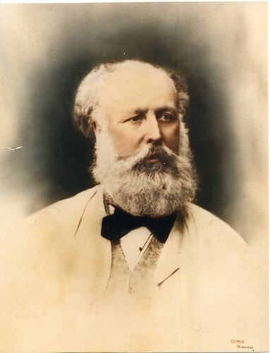 Hand coloured photographic portrait of a man with a beard.