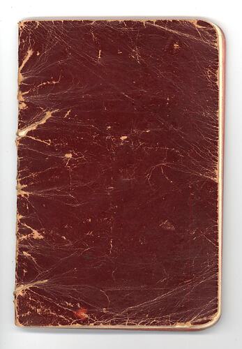Blank red book cover with worn texture.
