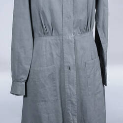 Grey cotton dress, pockets, buttons down front.