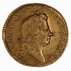 Gold coin with head.