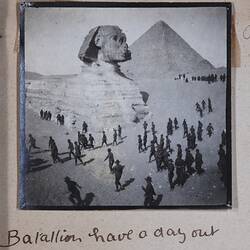 Photograph of men in military uniform with sphinx and pyramid in background, handwritten text below.