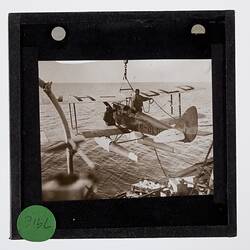 Lantern Slide - Gipsy Moth VH-ULD on the Aeroplane Hoist, BANZARE Voyage 1, Antarctica, 31 Dec 1929