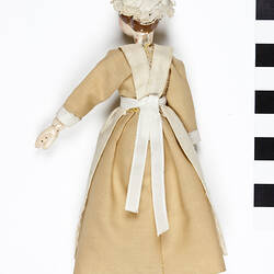 Rear view of doll in servant outfit