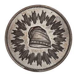Silver medal with central cap framed by radiating lines.