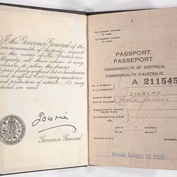 Open passport with white pages with printed pattern. Printed and handwritten text.