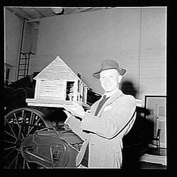 Negative - H.V McKay Massey Harris, Vern Eason with his Model of the McKay Farm Smithy, Sunshine, Victoria, 1954