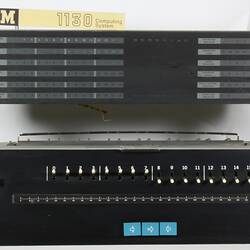 Black computer with levers and numbers.