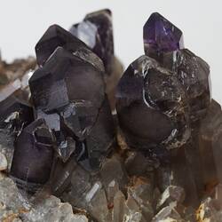 Blocky grey-purple amethyst crystals.