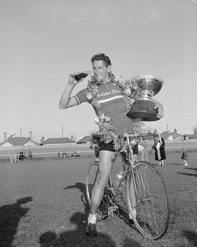 Coca-Cola, Cyclist Holding 'The Diamond House Cup', Footscray, Victoria, Sep 1954