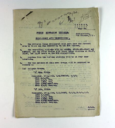 Off-white paper with printed text, staple in top left corner.
