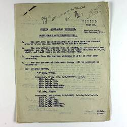 Off-white paper with printed text, staple in top left corner.