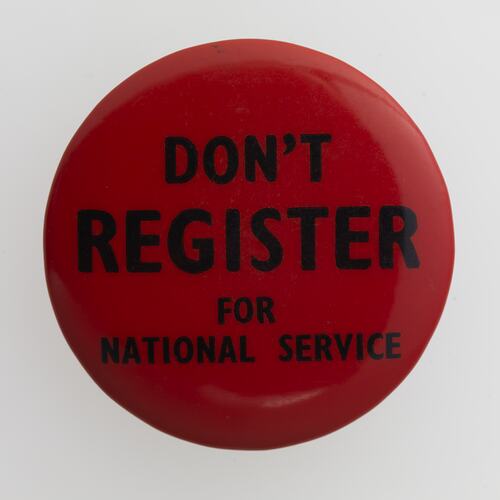 Circular red badge with black text.