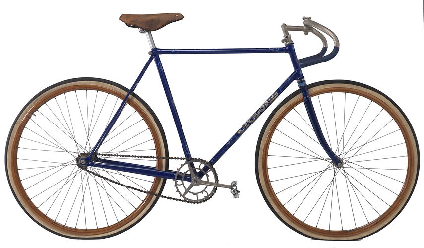 Blue metal bicycle with white decorative motifs and black and white inscriptions. Leather seat, wooden rims.