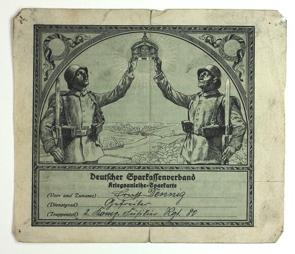 Illustration of two soldiers holding up a crown, printed and written text below.