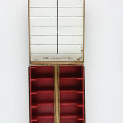 Inside of box with compartments and index label.