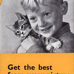 Leaflet with photograph of boy holding cat.