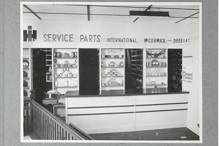 Monochrome photograph of a showroom interior.
