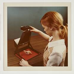 Photograph - Eastman Kodak, Woman Photographing Shell with Visualmaker, circa 1970s