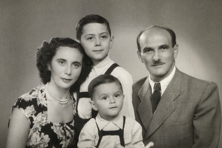 Portrait of man, woman and two male children.