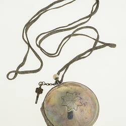 Gentleman's pocket watch in case and attached to silver plaited chain.