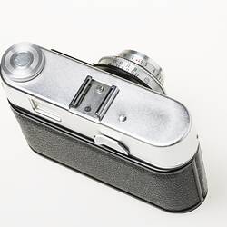 Black camera, metal top section. Top view.