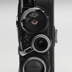 Front view of black movie camera.
