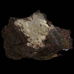 Rock with shiny cut surface.