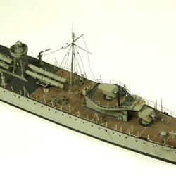 Grey coloured naval ship, detail of rear of deck.