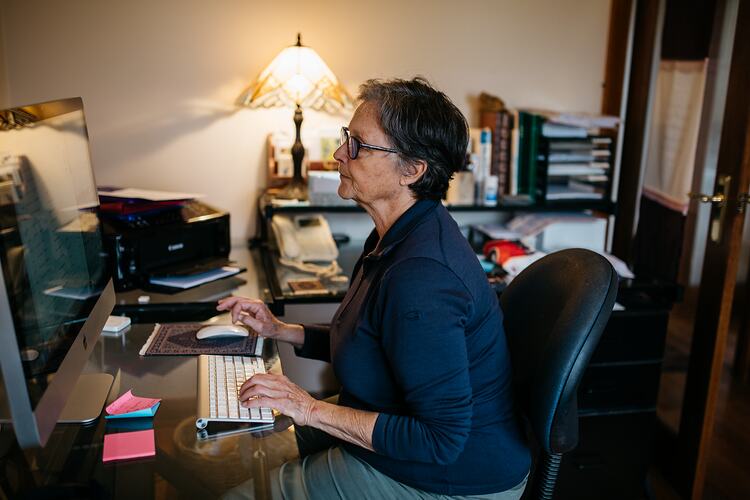 Woman working on a computer.