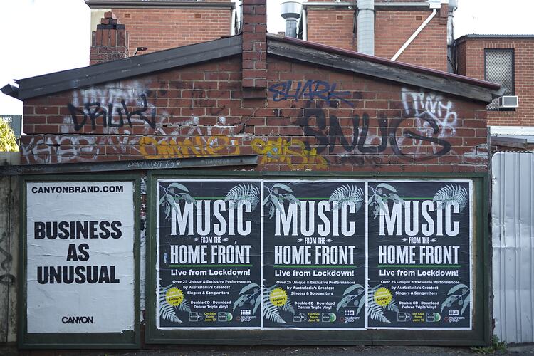 Posters on Billboard in Lane off Acland Street, St. Kilda, Melbourne, Jun 2020