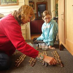 Digital Photograph - Laying Out Bottle Tops For Lagerphone, Jasmina Cininas With Young Teenager, Melbourne, 2014