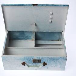 White metal case, lid open showing internal compartments.